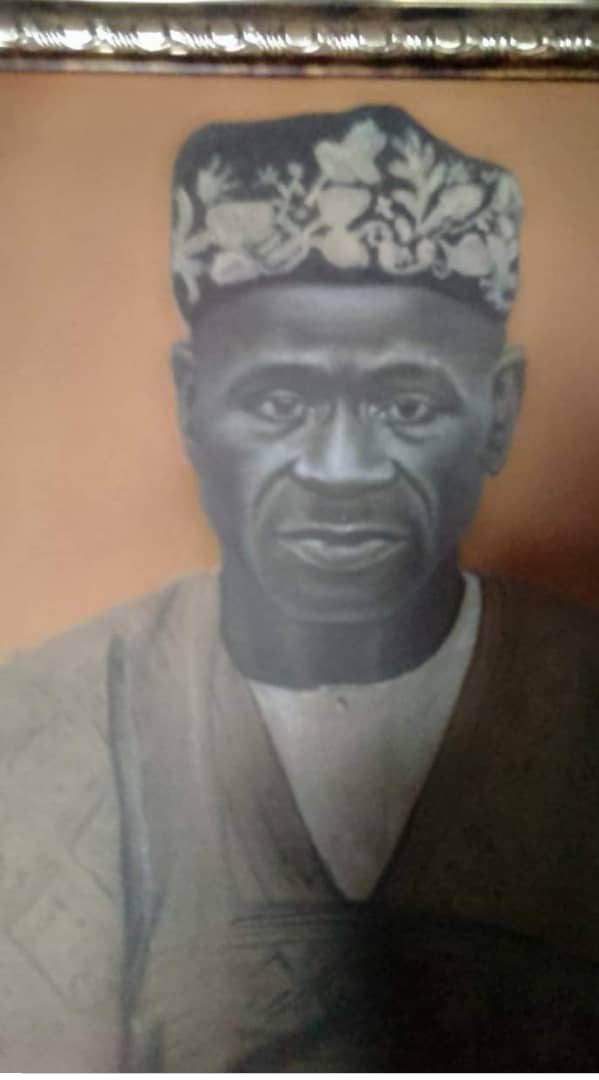 Painted portrait of Pa David Seriki Tomori Fapohunda in an embroidered cap