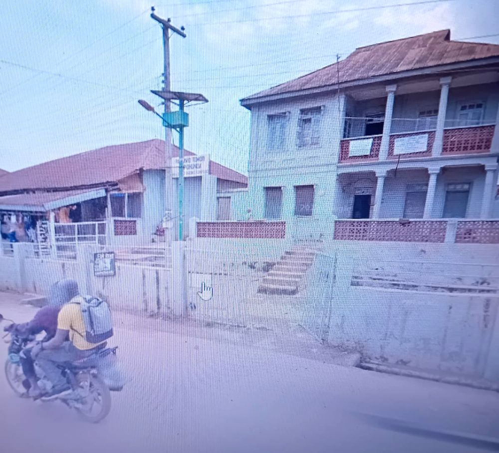 The Tomori family house, a two-storey building with a long upper balcony and patterned balustrades, at Ayeso, Ilesa